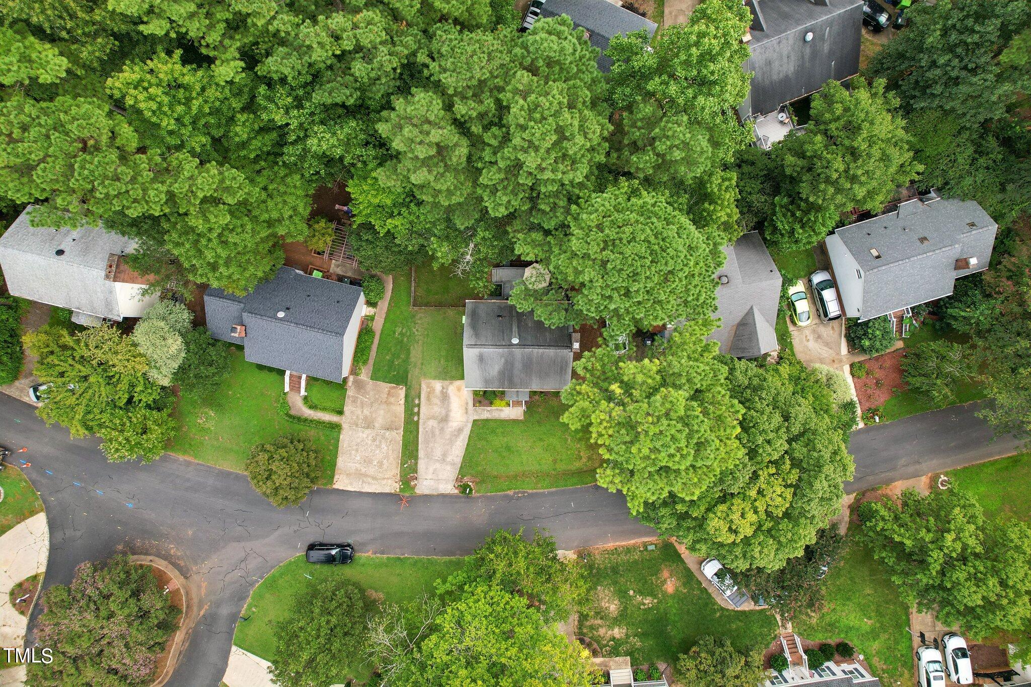 7012 Sandringham Drive Raleigh, NC 27613 - Photo 33 of 46 an aerial view of a house with a yard and a lot of flower plants