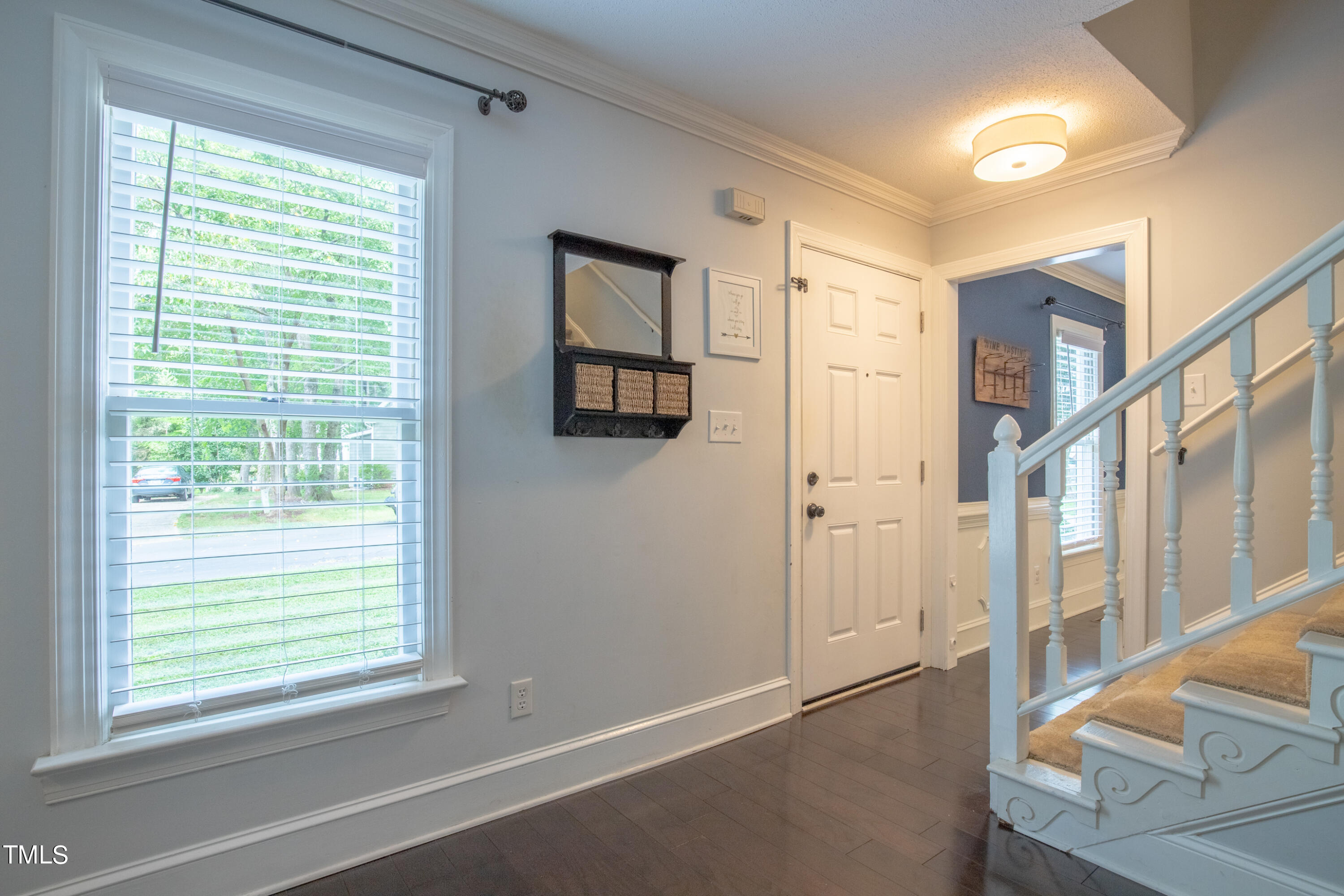 7012 Sandringham Drive Raleigh, NC 27613 - Photo 4 of 46 a view of an empty room with a window