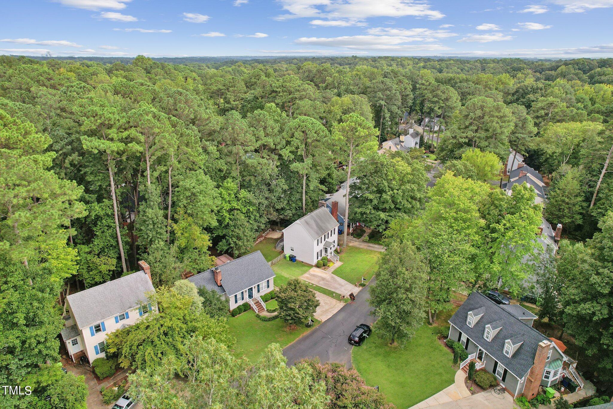 7012 Sandringham Drive Raleigh, NC 27613 - Photo 41 of 46 an aerial view of a house with a yard