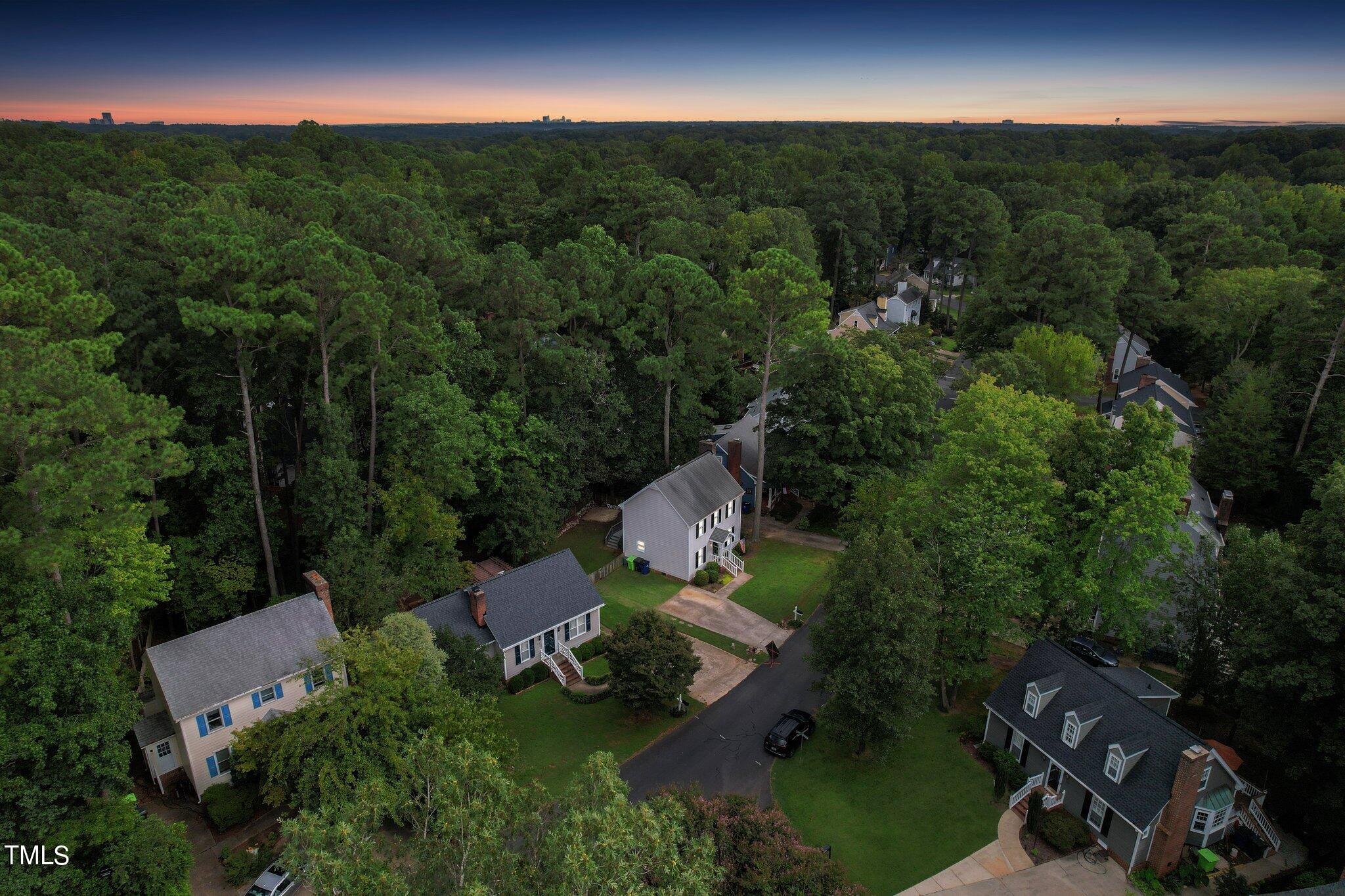 7012 Sandringham Drive Raleigh, NC 27613 - Photo 45 of 46 an aerial view of a house with pool yard seating and yard