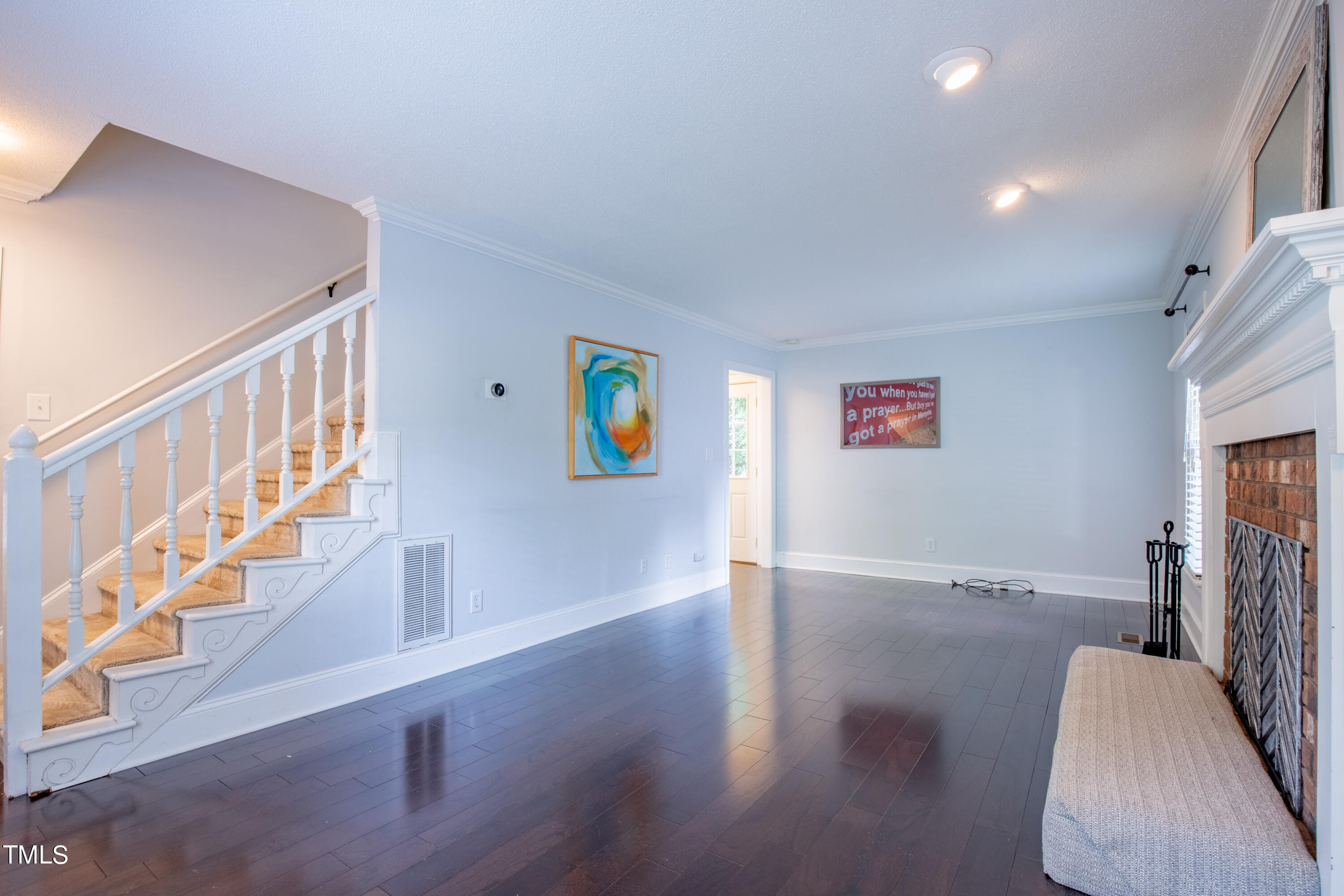 7012 Sandringham Drive Raleigh, NC 27613 - Photo 7 of 46 a view of entryway with wooden floor