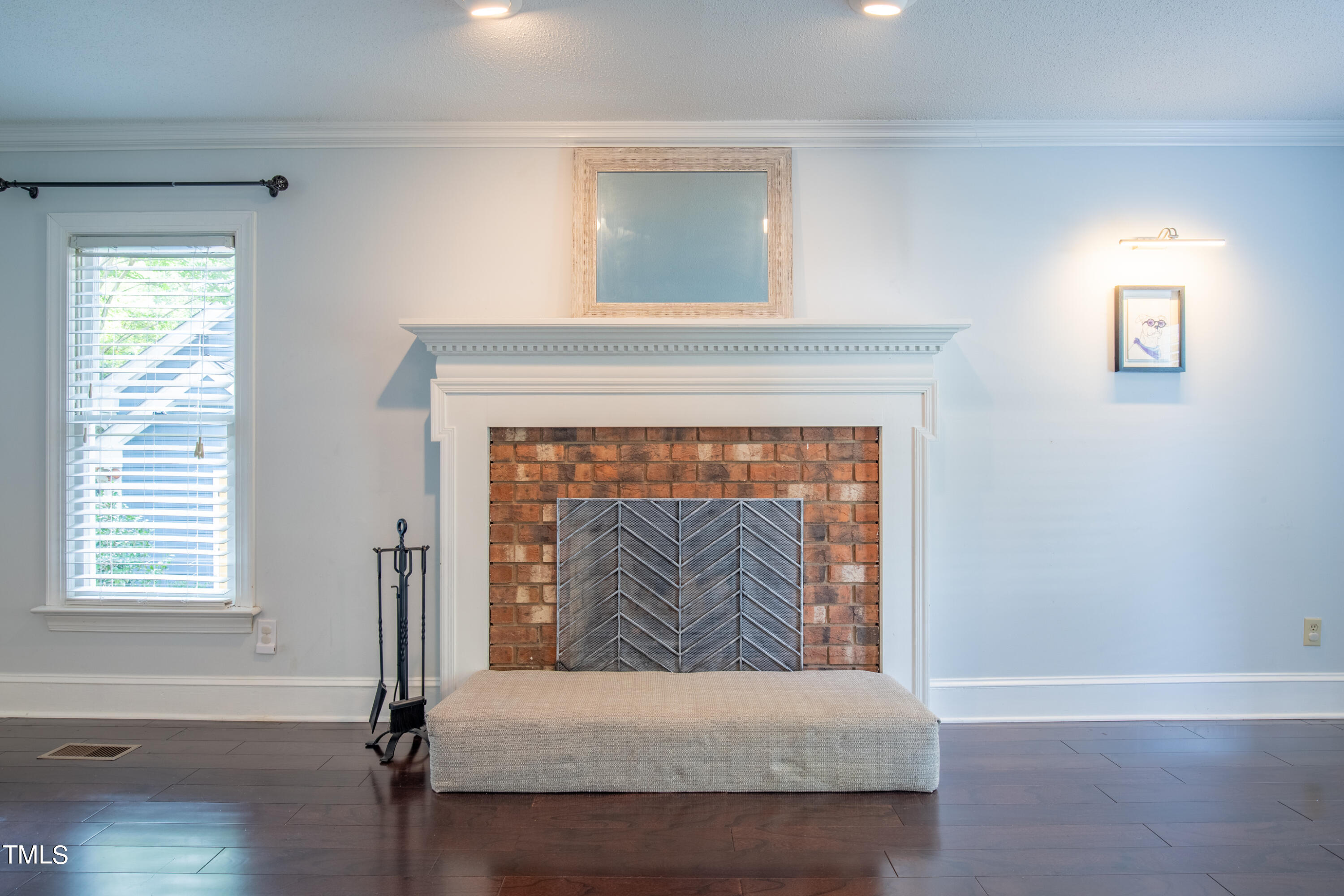 7012 Sandringham Drive Raleigh, NC 27613 - Photo 8 of 46 a living room with furniture and a fireplace