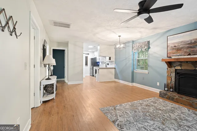a view of a kitchen with furniture and a fireplace