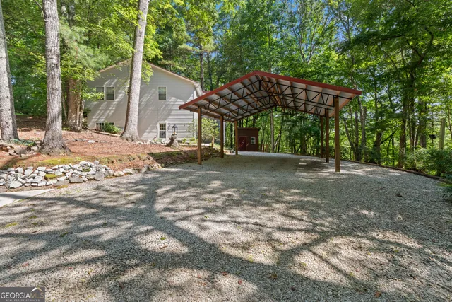 a view of a house with a tree