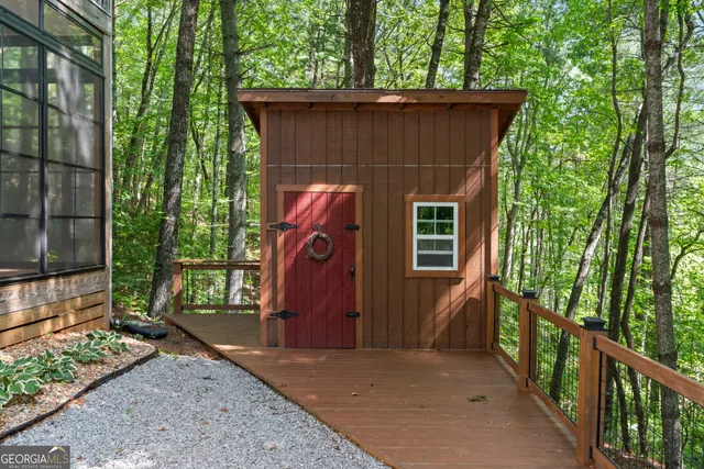 a view of a house with a tree beside it