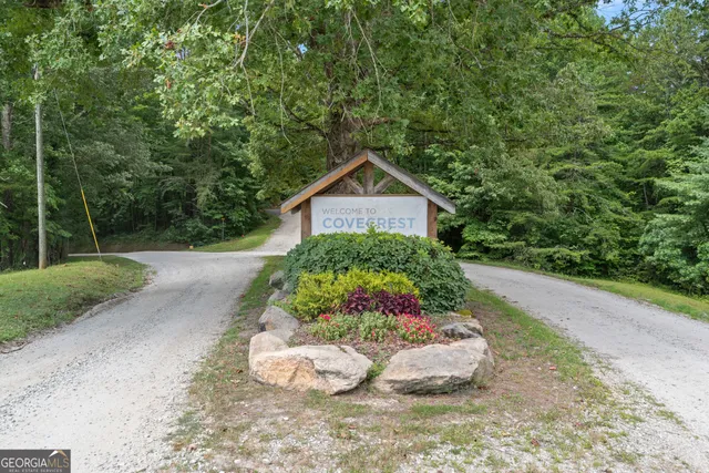 a view of a road with a car parked