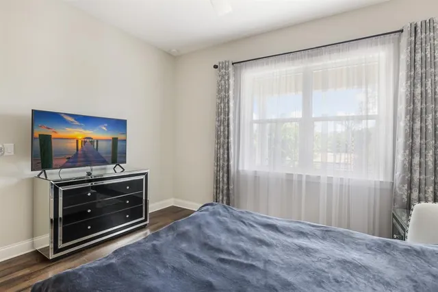 a view of room with cabinet and flat screen tv
