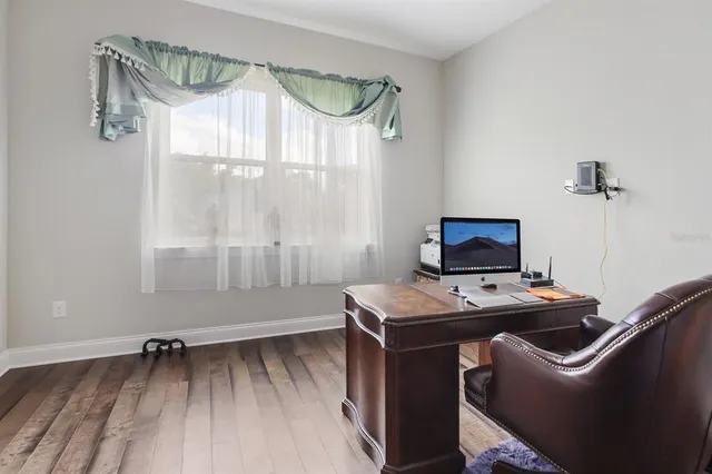 a room that has a bed and a table in it