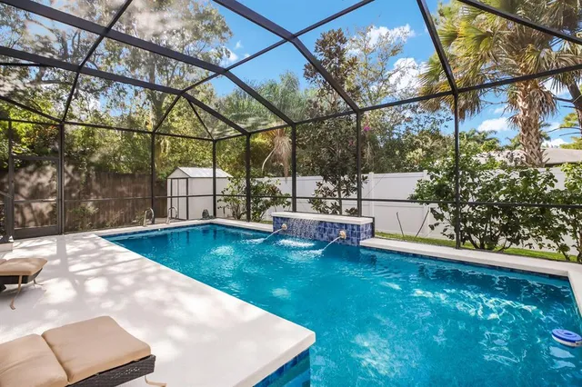 a view of a swimming pool with a patio