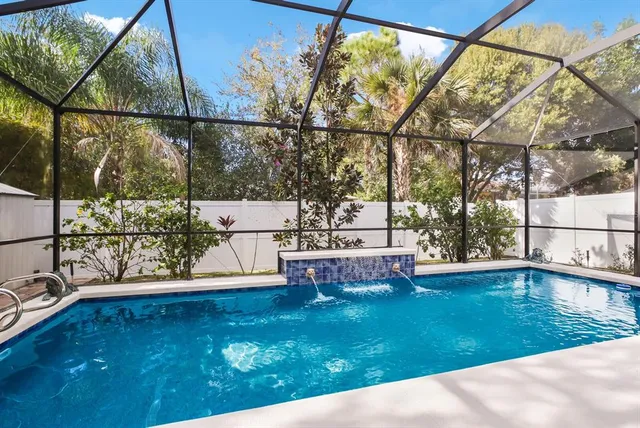 a view of a swimming pool with a patio