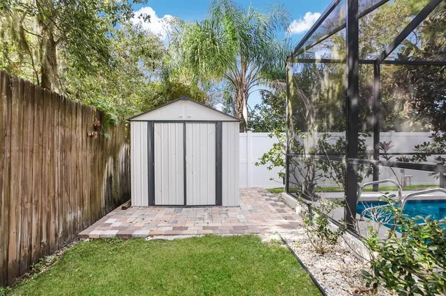 a couple of potted plants sitting in front of a house