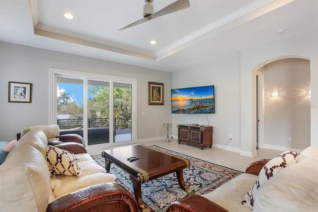 a living room with furniture a rug and a flat screen tv