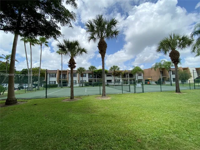 a view of a park with swings and slides