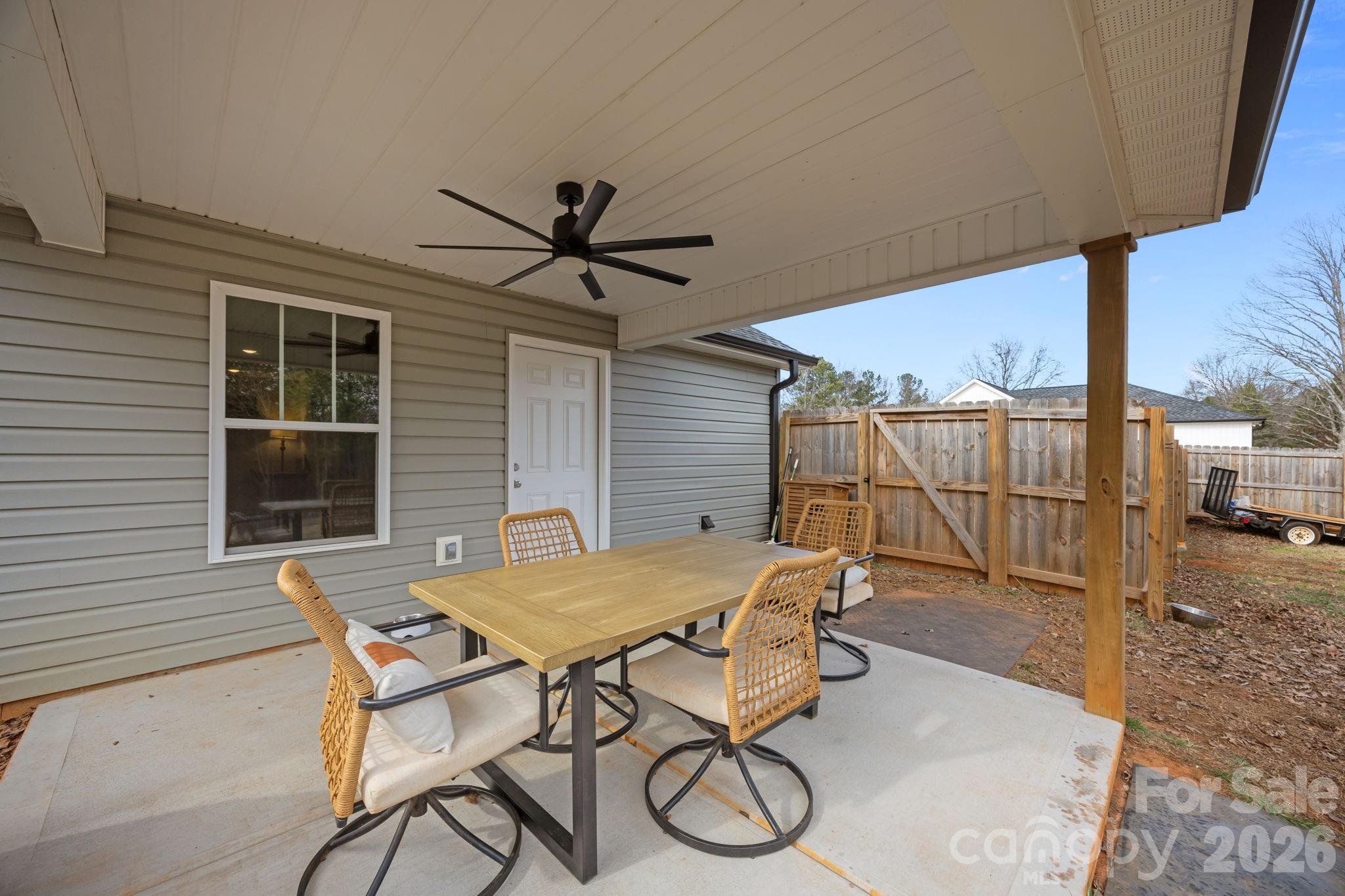 1464 State Rd S-46-996 York, SC 29745 - Photo 12 of 17 a patio with table and chairs
