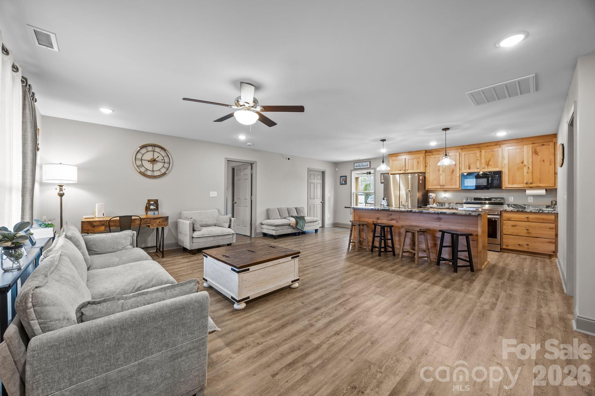 1464 State Rd S-46-996 York, SC 29745 - Photo 4 of 17 a living room with furniture and kitchen view with wooden floor