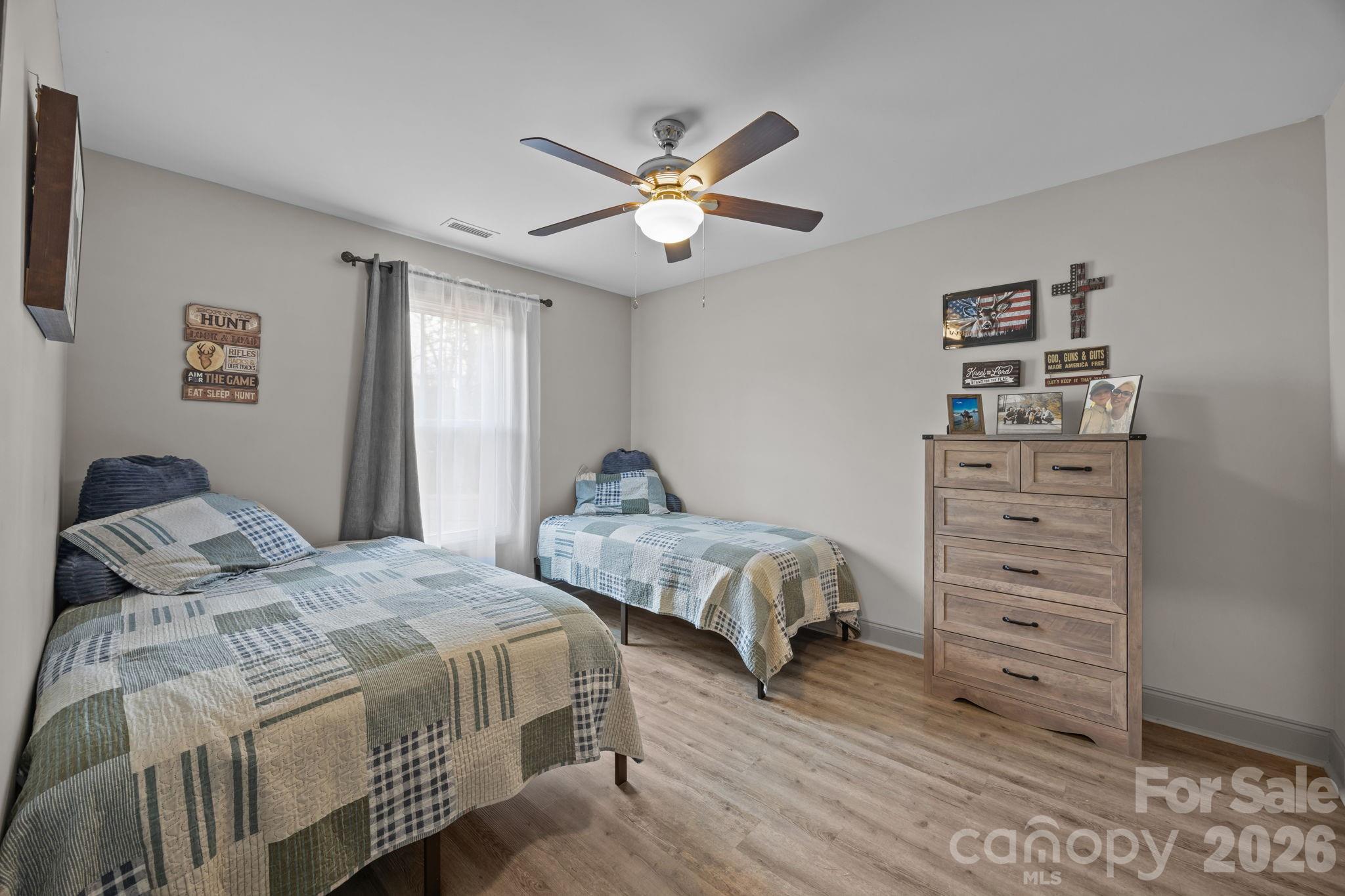 1464 State Rd S-46-996 York, SC 29745 - Photo 8 of 17 a bedroom with a bed and a chandelier