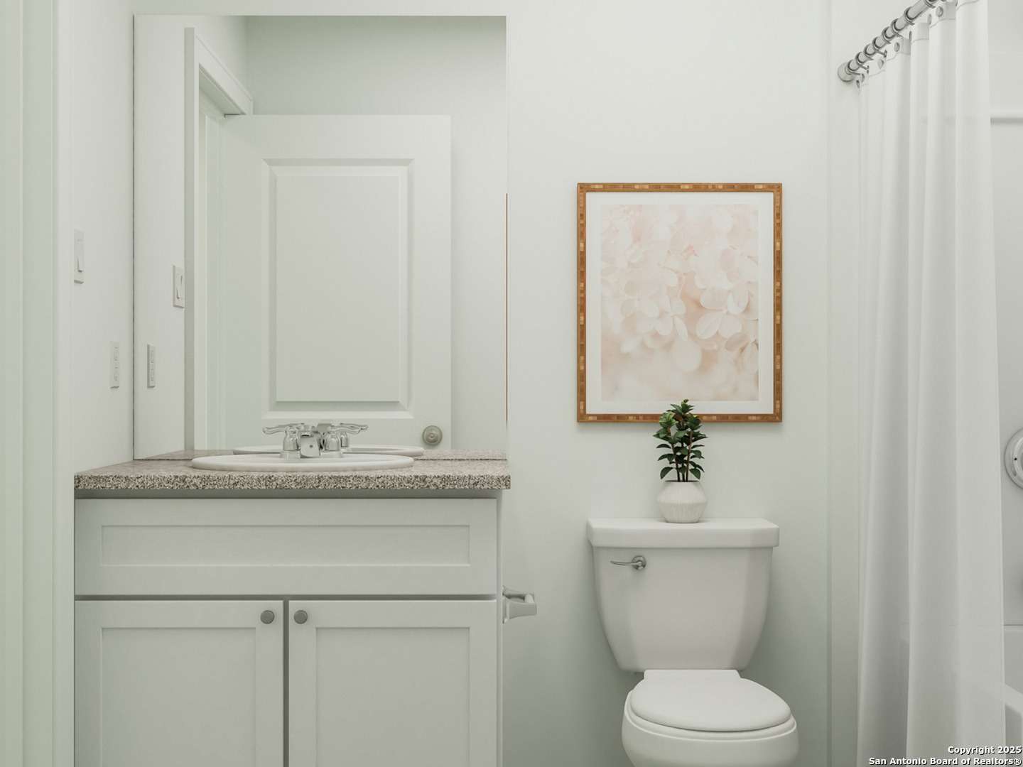 13307 Dutra Road San Antonio, TX 78221 - Photo 16 of 33 a bathroom with a granite countertop toilet sink and mirror
