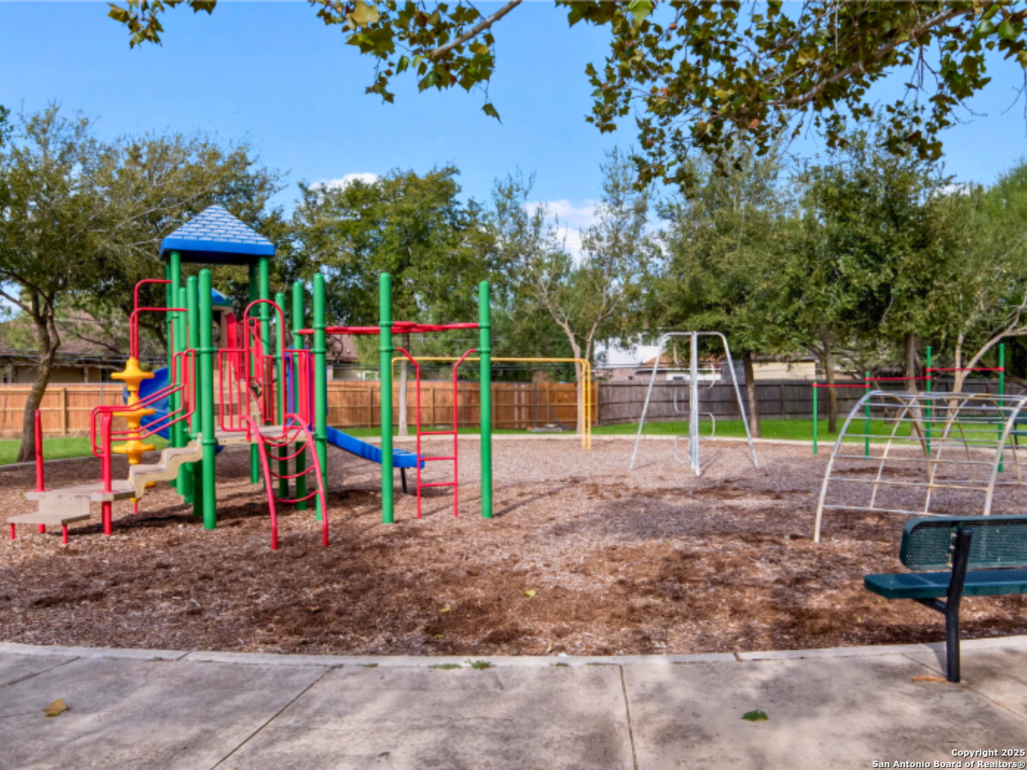13307 Dutra Road San Antonio, TX 78221 - Photo 28 of 33 a view of a park with swings and slides