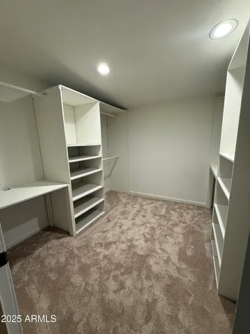 a view of an empty room with a fireplace