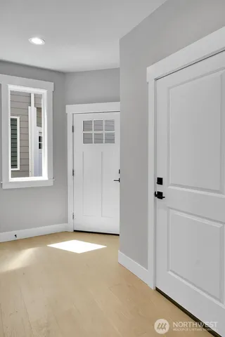 a view of a kitchen with a sink and cabinets