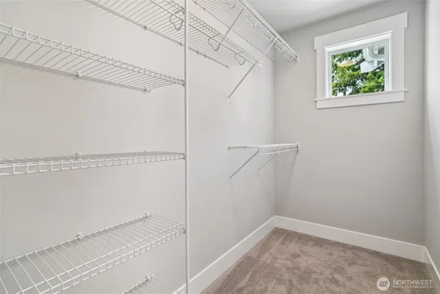 a bathroom with a tub sink double and mirror