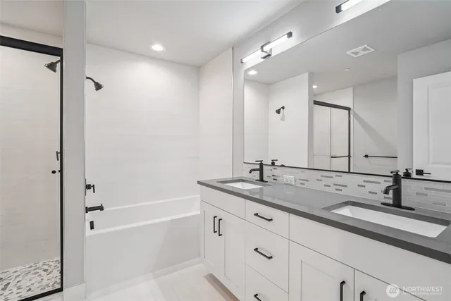 a bathroom with a bathtub and a shower