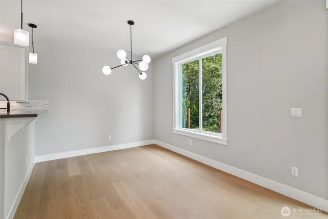 a bathroom with a sink toilet a mirror and vanity