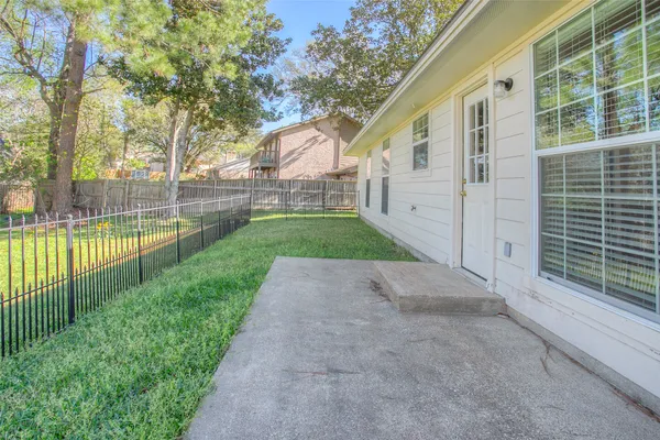 a view of a back yard with green space