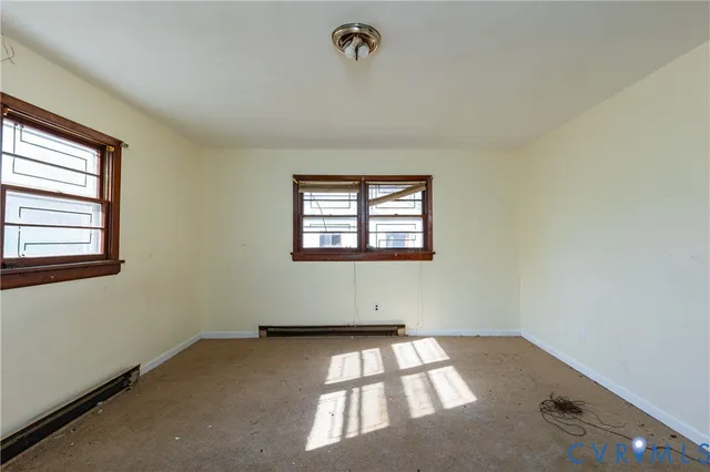 an empty room with windows