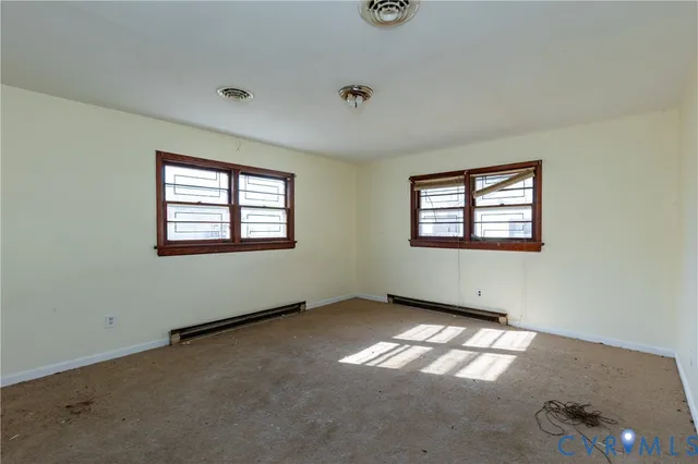 a view of empty room with windows