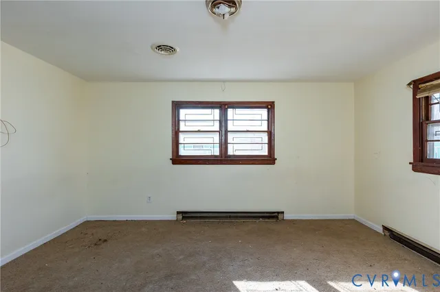 an empty room with windows