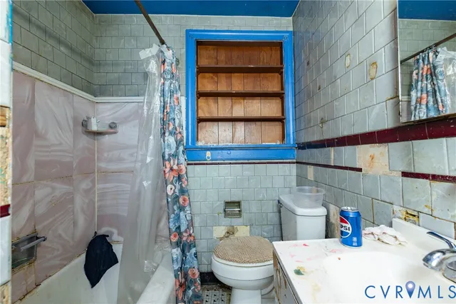 a bathroom with a toilet and a sink