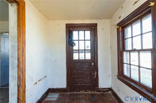 a view of front door with wooden floor