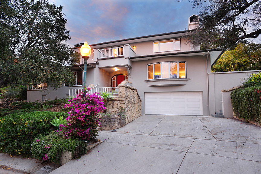 1736 Lasuen Road Santa Barbara, CA 93103 - Photo 1 of 17 a front view of a house with a yard and a garage
