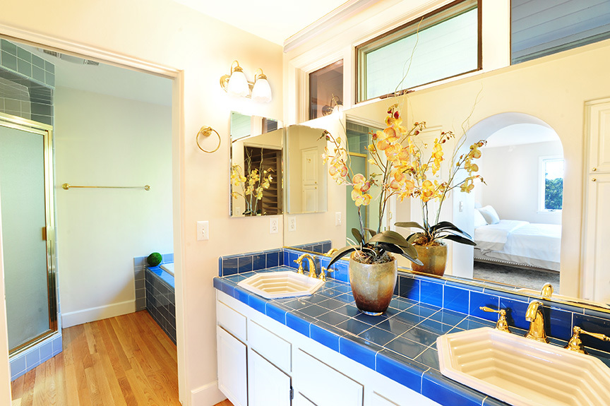 1736 Lasuen Road Santa Barbara, CA 93103 - Photo 12 of 17 a bedroom with a bed and a potted plant
