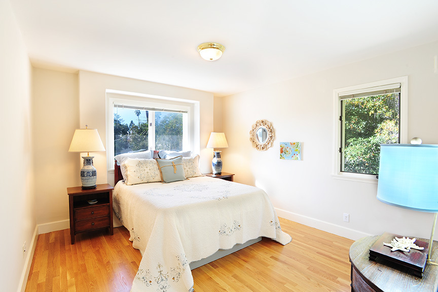 1736 Lasuen Road Santa Barbara, CA 93103 - Photo 14 of 17 a bedroom with a bed and a window