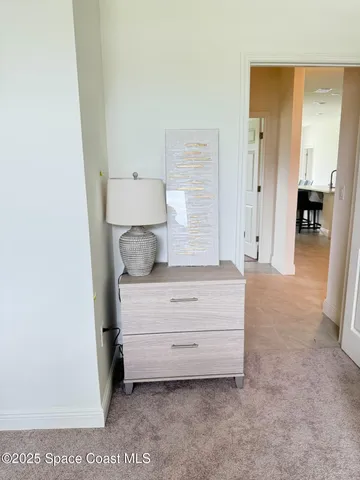 a view of room with cabinet and mirror