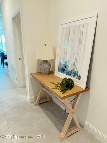 a living room with a table and a window