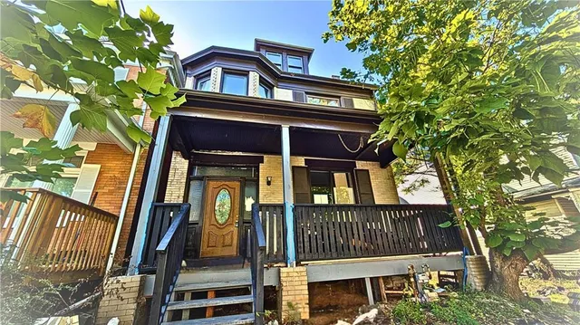 front view of a house with a small yard