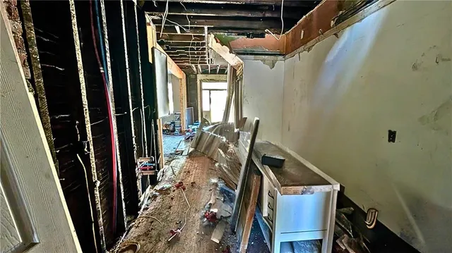 a view of walk in closet with clothes