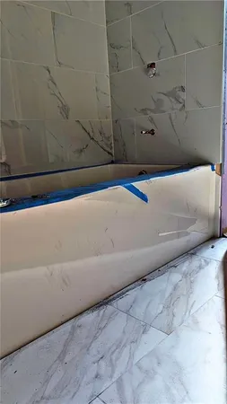 a view of a bathtub in a bathroom
