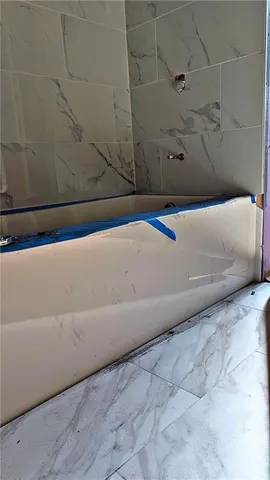 a view of a bathtub in a bathroom