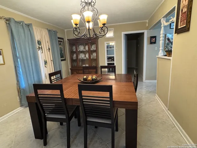 a living room with furniture and a mirror