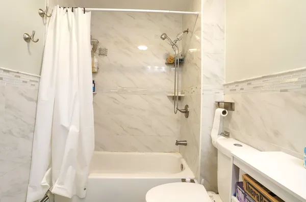 a bathroom with a sink a toilet and a bathtub