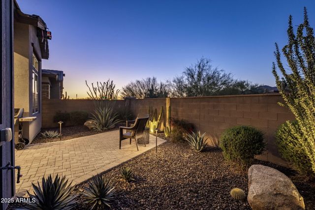 a view of a backyard with plants and lake view