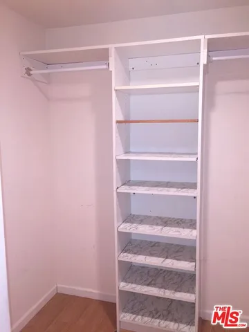 a view of an empty walk in closet