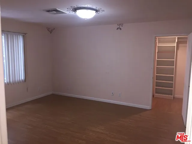 an empty room with a empty space and window