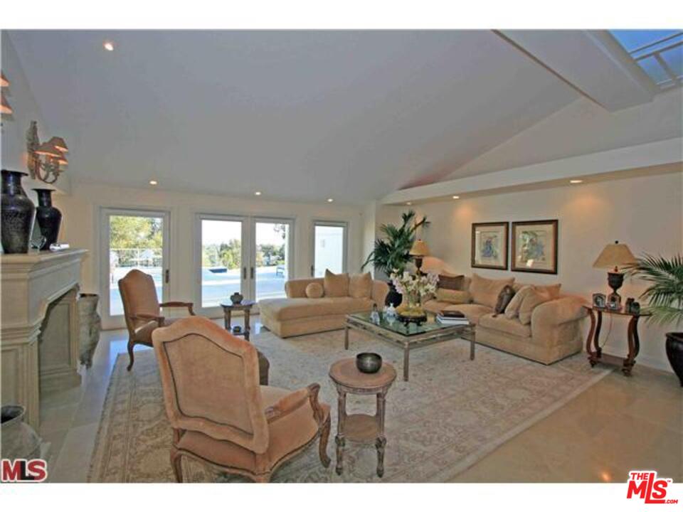 1148 Las Pulgas Road Pacific Palisades, CA 90272 - Photo 2 of 13 a living room with furniture and a large window