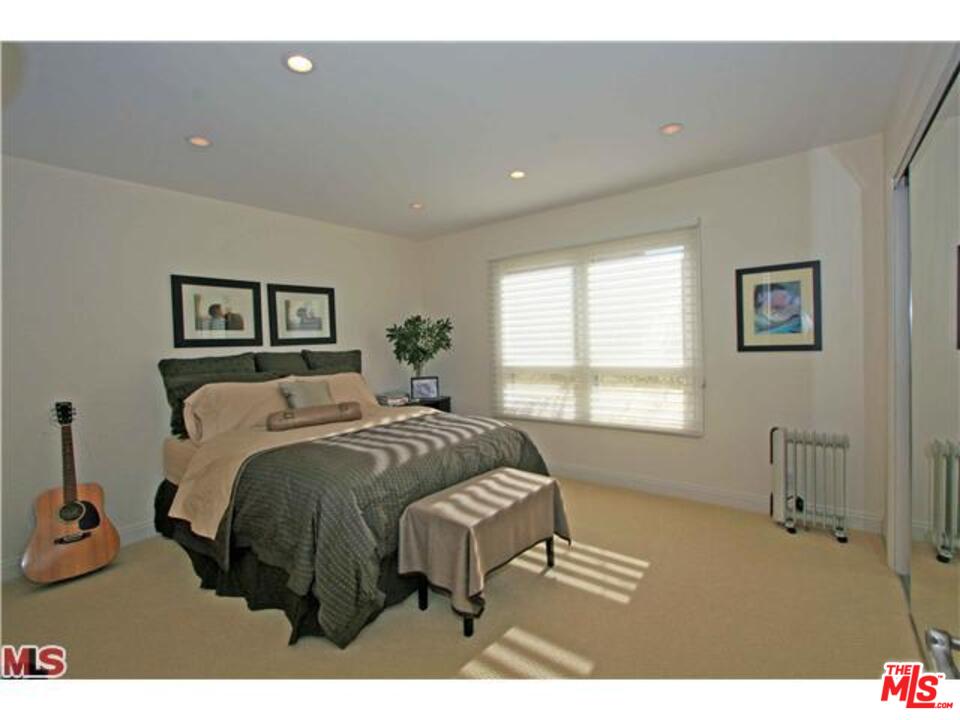 1148 Las Pulgas Road Pacific Palisades, CA 90272 - Photo 11 of 13 a bed room with a bed and a window