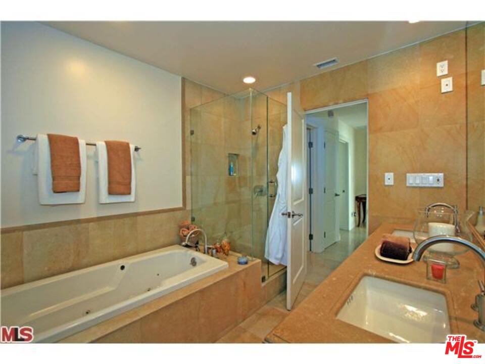 1148 Las Pulgas Road Pacific Palisades, CA 90272 - Photo 12 of 13 a bathroom with a tub a sink and mirror